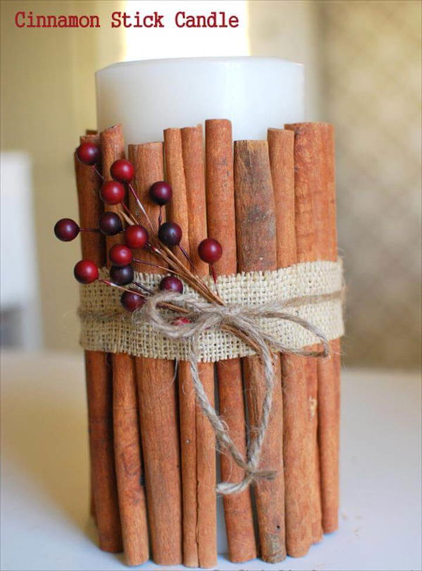 candle with cinnamon sticks