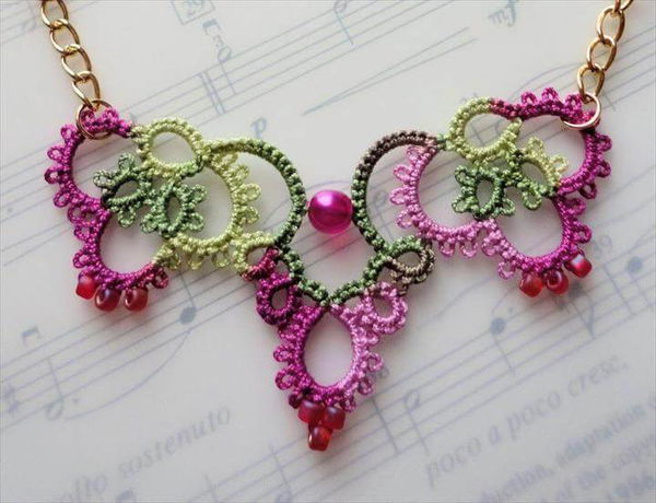 ochet jewelry pink crochet necklace laying on music book