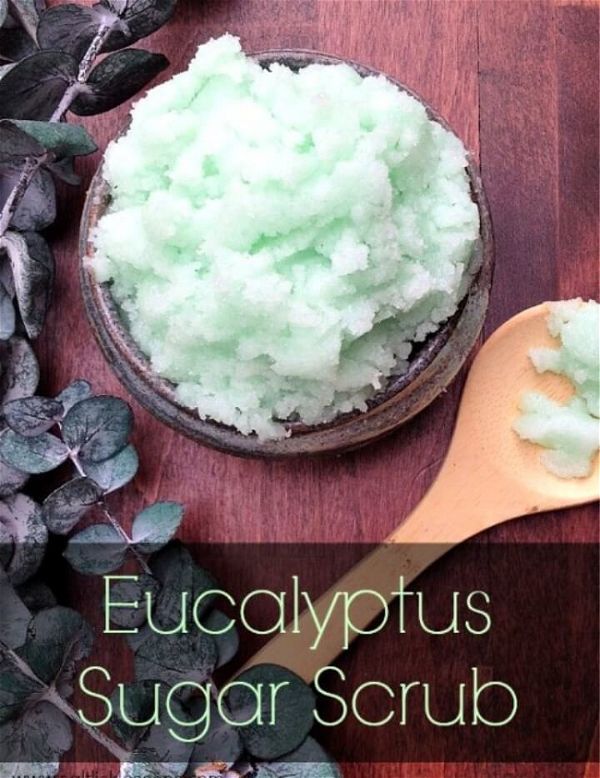 mint green eucalyptus scrub on a wooden table with a wooden spoon